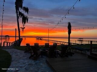 patio terrace at dusk with a water view