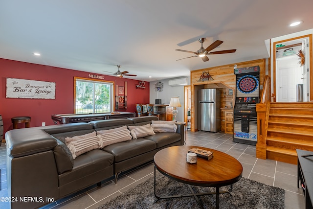 tiled living room featuring an AC wall unit, wine cooler, wooden walls, and ceiling fan