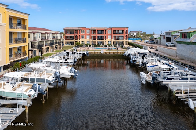 view of dock with a water view and a balcony