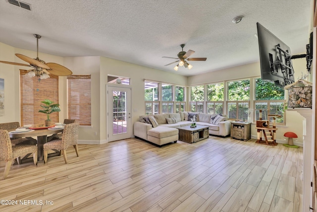 interior space with ceiling fan