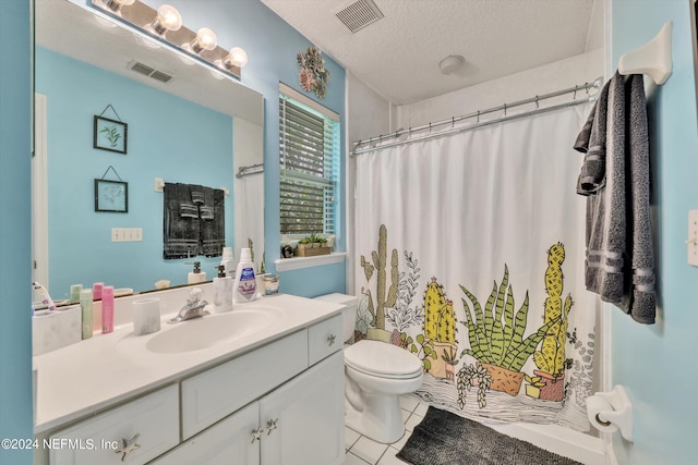 bathroom with a shower with shower curtain, vanity, a textured ceiling, tile patterned flooring, and toilet