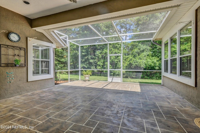 unfurnished sunroom featuring a healthy amount of sunlight