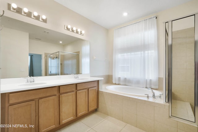 bathroom featuring shower with separate bathtub, dual bowl vanity, and tile flooring