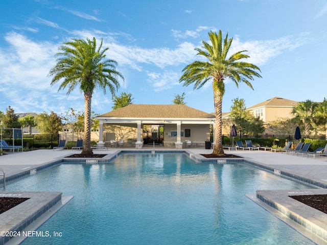 view of swimming pool with a patio area