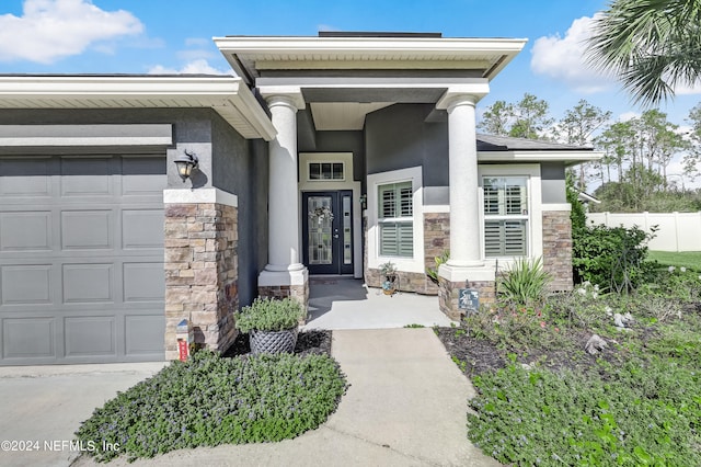 property entrance with french doors and a garage