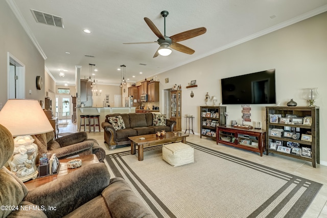 living room with light tile flooring, ceiling fan, and crown molding