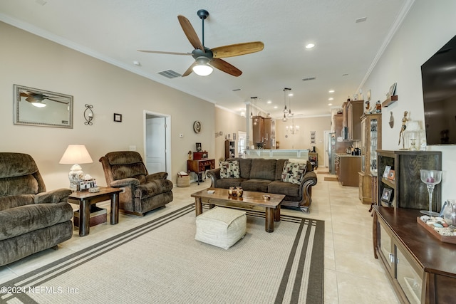 living room featuring ornamental molding, ceiling fan, and light tile floors