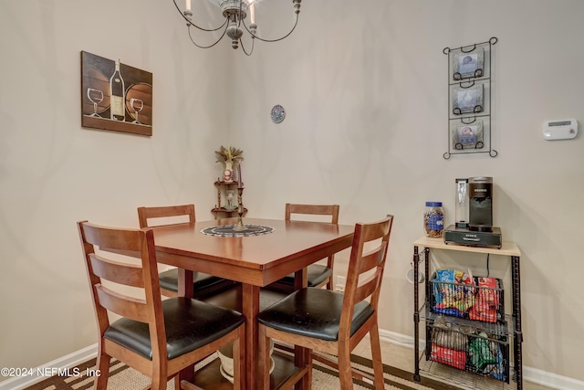 dining area with a notable chandelier