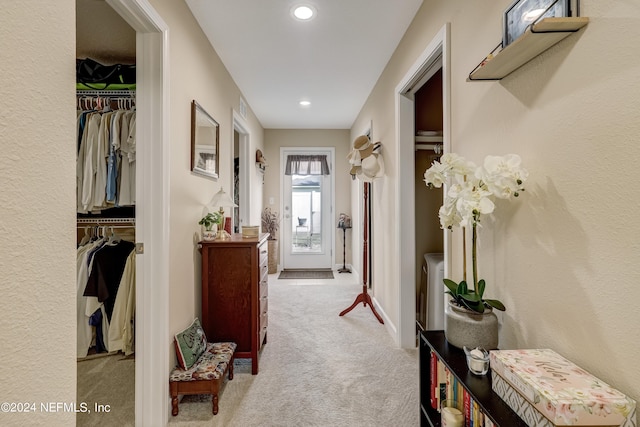 corridor with light colored carpet