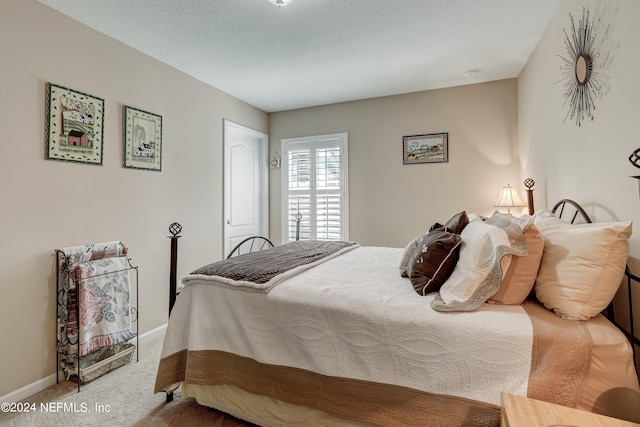 bedroom featuring light colored carpet