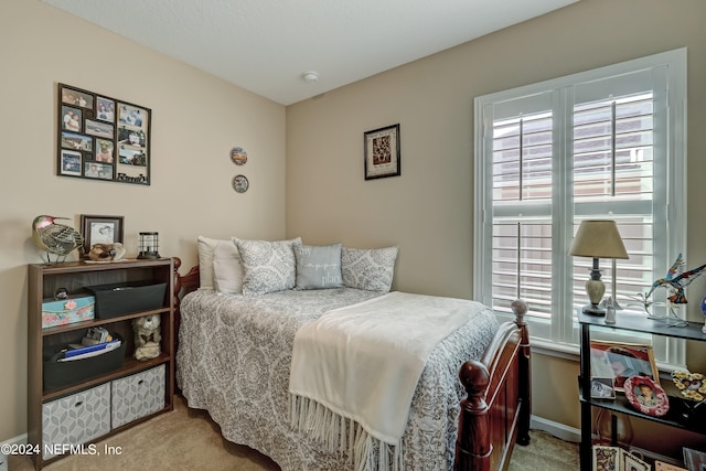 bedroom with light carpet