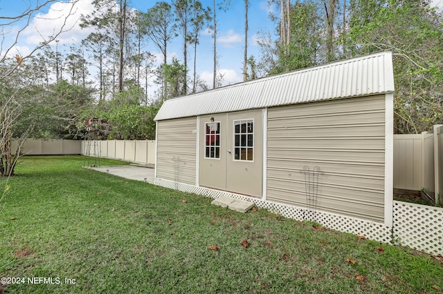 view of outdoor structure with a lawn