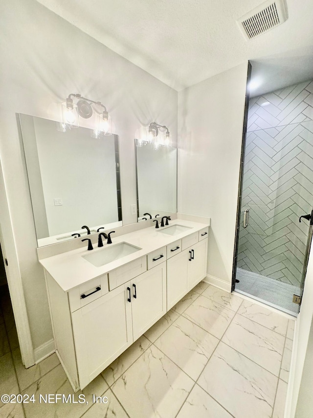 bathroom with dual bowl vanity, tile flooring, and an enclosed shower