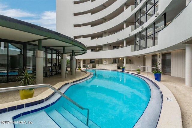 view of pool featuring a patio area