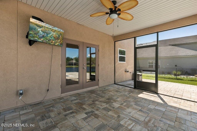 unfurnished sunroom with french doors