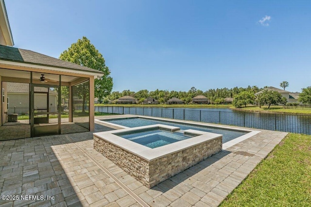 view of pool with a water view, ceiling fan, an in ground hot tub, a fenced backyard, and a patio