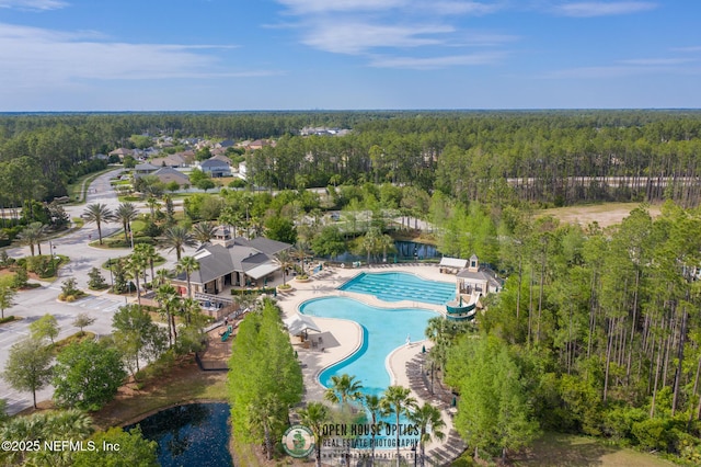 bird's eye view featuring a wooded view