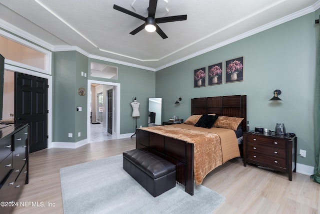 bedroom featuring ornamental molding, light hardwood / wood-style floors, and ceiling fan