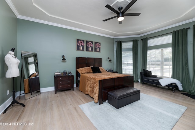 bedroom featuring crown molding, ceiling fan, and light wood-type flooring