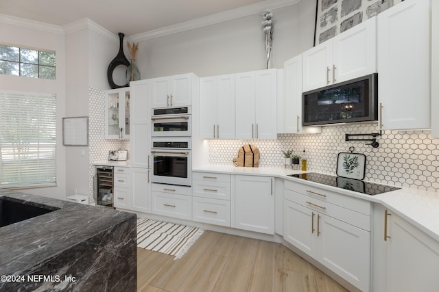 kitchen with stainless steel appliances, wine cooler, tasteful backsplash, white cabinetry, and crown molding