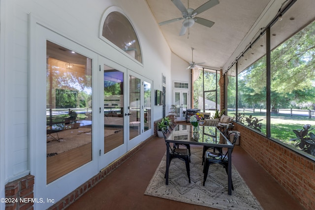 sunroom / solarium with french doors, ceiling fan, and lofted ceiling