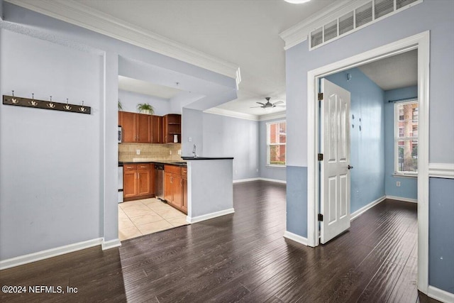 kitchen with crown molding, dishwasher, ceiling fan, light hardwood / wood-style floors, and backsplash