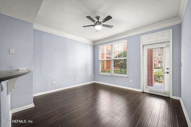 unfurnished room featuring ornamental molding, a textured ceiling, and dark hardwood / wood-style flooring