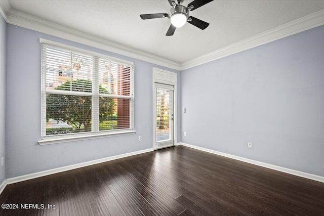 spare room with crown molding, ceiling fan, and dark hardwood / wood-style flooring