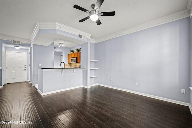 unfurnished living room with ornamental molding, sink, ceiling fan, and dark hardwood / wood-style flooring