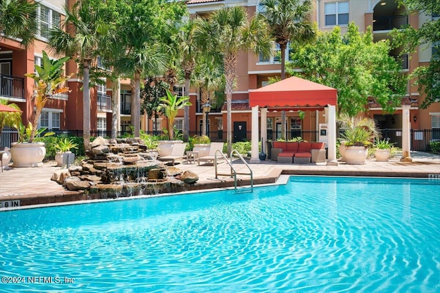 view of pool featuring a patio area