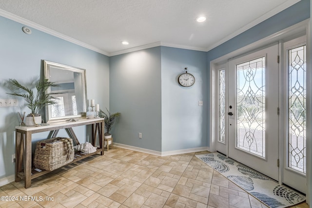 tiled entryway with plenty of natural light, a textured ceiling, and crown molding