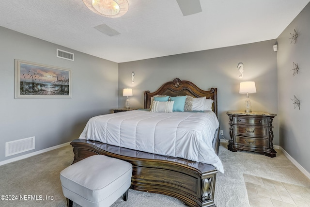 bedroom with light colored carpet