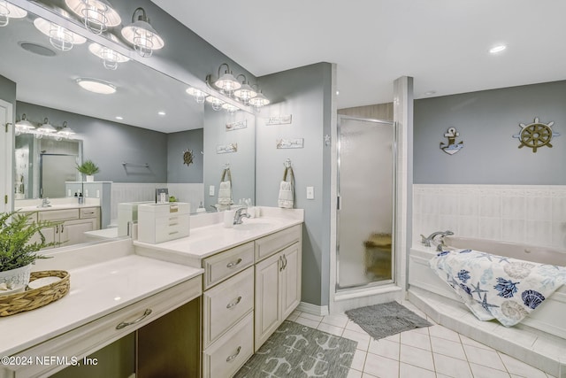 bathroom featuring separate shower and tub, double sink vanity, and tile flooring