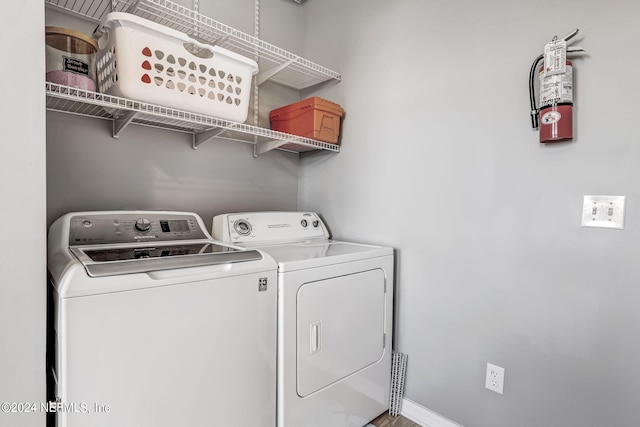 laundry area featuring washing machine and clothes dryer