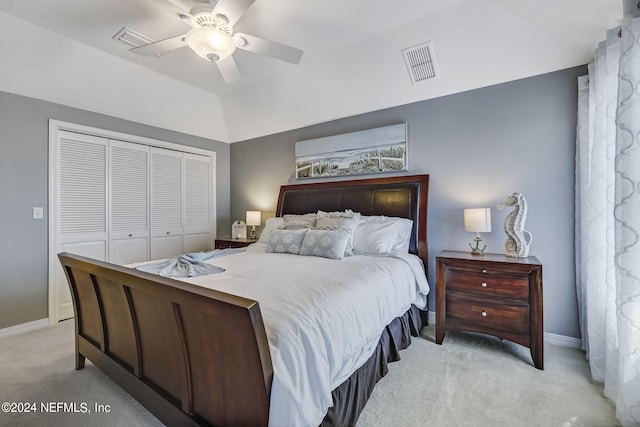 bedroom featuring a closet, ceiling fan, and light colored carpet