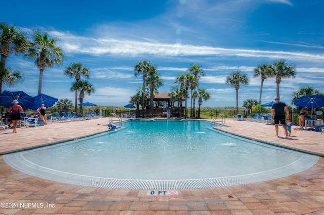 view of swimming pool featuring pool water feature