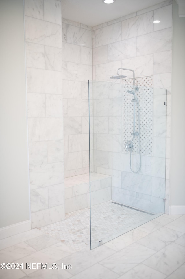 bathroom with tiled shower