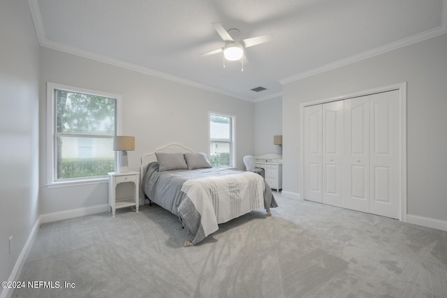 bedroom featuring multiple windows, ceiling fan, and light carpet