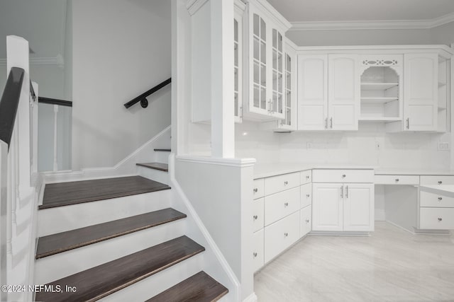 stairway with crown molding