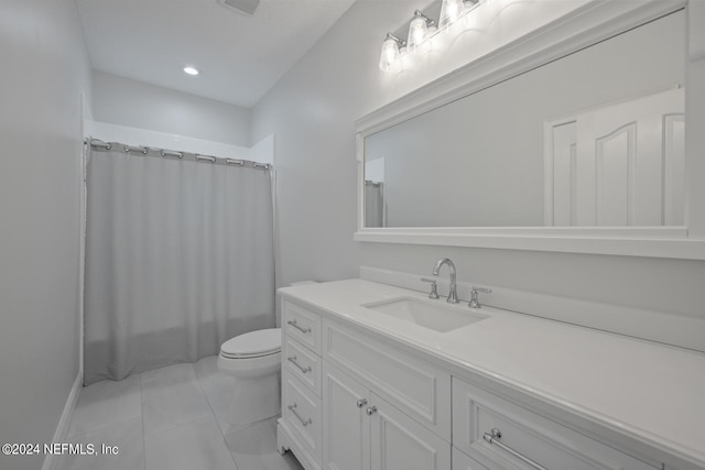 bathroom featuring vanity, toilet, and walk in shower