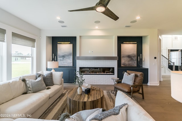 living room featuring hardwood / wood-style flooring, a wealth of natural light, and ceiling fan