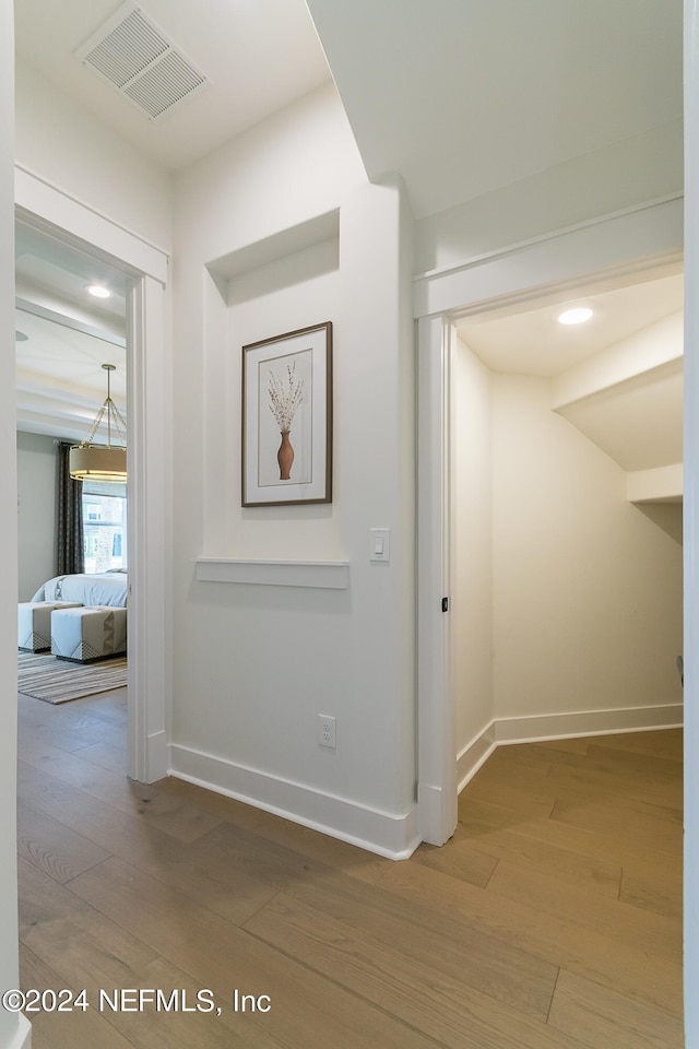 hallway featuring hardwood / wood-style floors