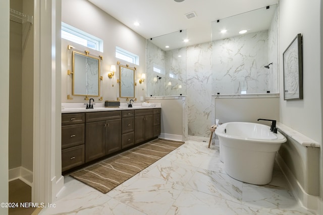 bathroom featuring vanity and a bath