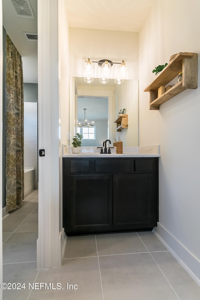 bathroom featuring tile patterned flooring and vanity