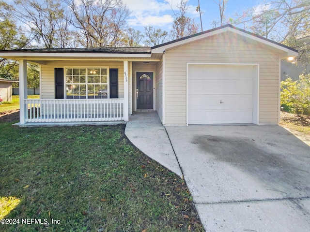 single story home featuring a porch, a front yard, and a garage