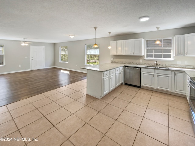 kitchen featuring white cabinetry, kitchen peninsula, ceiling fan, and appliances with stainless steel finishes