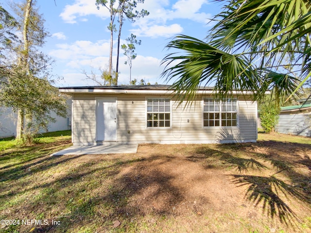 back of property with a patio area