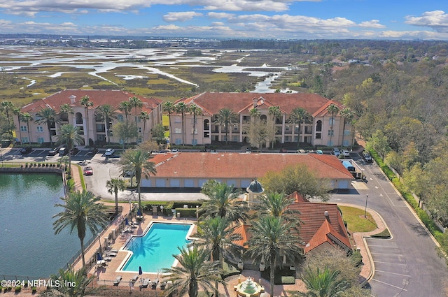 birds eye view of property with a water view