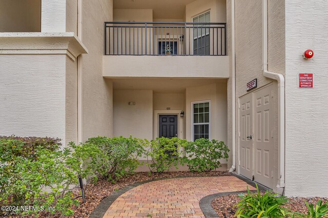 doorway to property with a balcony