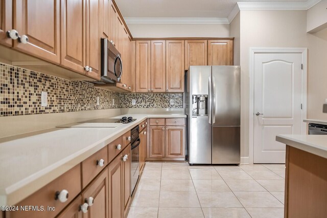 kitchen with tasteful backsplash, light tile patterned floors, stainless steel appliances, and crown molding